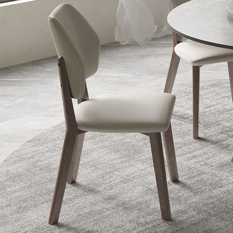 Upholstered dining chair with wood legs